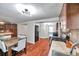 Inviting kitchen features stainless steel appliances, granite countertops, and a breakfast nook perfect for casual dining at 1111 32Nd N St, St Petersburg, FL 33713