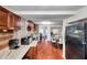 Open concept kitchen with stainless steel appliances and views into the dining area at 1111 32Nd N St, St Petersburg, FL 33713