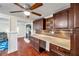 Kitchen featuring a stylish backsplash, stainless steel appliances, and wood cabinetry at 1111 32Nd N St, St Petersburg, FL 33713