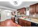 Modern kitchen with stainless steel appliances, stylish backsplash, and wood cabinets at 1111 32Nd N St, St Petersburg, FL 33713