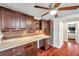 Kitchen featuring a stylish backsplash, stainless steel appliances, and wood cabinetry at 1111 32Nd N St, St Petersburg, FL 33713