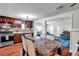 Open-concept kitchen and living area with wood cabinets and modern appliances at 1111 32Nd N St, St Petersburg, FL 33713