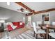 Comfortable living room features stylish ceiling fan, hardwood accent, and gray walls at 1111 32Nd N St, St Petersburg, FL 33713