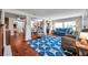 Spacious living room boasts hardwood floors, an open layout, and lots of natural light at 1111 32Nd N St, St Petersburg, FL 33713