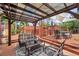 Inviting covered patio featuring comfortable seating, a stylish rug, and access to a deck, perfect for outdoor relaxation at 1111 32Nd N St, St Petersburg, FL 33713