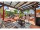 Outdoor patio area with comfortable seating, dining set, grill and shade, perfect for entertaining and relaxing at 1111 32Nd N St, St Petersburg, FL 33713