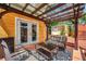Charming outdoor patio with seating area, accessed by french doors and a mini-fridge; ideal for entertaining guests at 1111 32Nd N St, St Petersburg, FL 33713