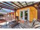 Back patio area features seating, grill, and a covered area offering an inviting outdoor space at 1111 32Nd N St, St Petersburg, FL 33713