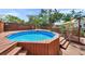 Backyard features an above ground pool with privacy fence and wood deck at 1111 32Nd N St, St Petersburg, FL 33713