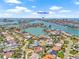 Aerial view of the property in St Pete Beach with beautiful views of the water at 1141 80Th Street S Ct, St Petersburg, FL 33707
