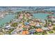 Aerial view of a home in a waterfront community surrounded by lush landscaping at 1141 80Th Street S Ct, St Petersburg, FL 33707