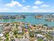 An aerial view showing the residence with its waterfront location and proximity to nearby cityscape at 1141 80Th Street S Ct, St Petersburg, FL 33707