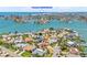 A beautiful aerial view showcasing waterfront homes and access to Treasure Island Beach at 1141 80Th Street S Ct, St Petersburg, FL 33707