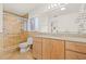 Bright bathroom featuring modern vanity, granite counters, and walk-in shower at 1141 80Th Street S Ct, St Petersburg, FL 33707