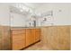 Bright bathroom featuring modern vanity, granite counters, and tile walls at 1141 80Th Street S Ct, St Petersburg, FL 33707
