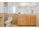 Bright bathroom with modern vanity, granite counters, and tiled shower at 1141 80Th Street S Ct, St Petersburg, FL 33707