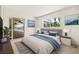 Stylized bedroom with view of pool, large bed, and bright decor at 1141 80Th Street S Ct, St Petersburg, FL 33707