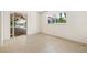 Bright bedroom featuring sliding glass doors to the pool and lots of natural light at 1141 80Th Street S Ct, St Petersburg, FL 33707