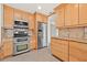 Bright kitchen features stainless steel appliances, light wood cabinets and granite countertops at 1141 80Th Street S Ct, St Petersburg, FL 33707