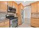 Updated eat-in kitchen with stainless steel appliances and tile backsplash at 1141 80Th Street S Ct, St Petersburg, FL 33707