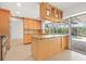 Updated eat-in kitchen with a center island, and view of the pool at 1141 80Th Street S Ct, St Petersburg, FL 33707