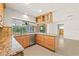 Granite countertops in an updated kitchen with a view of the backyard pool at 1141 80Th Street S Ct, St Petersburg, FL 33707