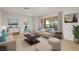 Bright living room with comfortable seating, large windows, and natural light at 1141 80Th Street S Ct, St Petersburg, FL 33707