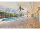 Lanai overlooking a private pool surrounded by lush landscaping at 1141 80Th Street S Ct, St Petersburg, FL 33707