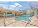 Sparkling pool with screened enclosure and a bar area for outdoor entertaining at 1141 80Th Street S Ct, St Petersburg, FL 33707
