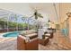 Relax on the lanai overlooking a private pool and lush tropical landscaping at 1141 80Th Street S Ct, St Petersburg, FL 33707