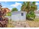 A white shed located in the backyard at 1141 80Th Street S Ct, St Petersburg, FL 33707