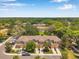 An aerial view showcasing the townhome complex in a community with trees at 11611 Mango Ridge Blvd, Seffner, FL 33584