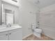 Bathroom featuring a single sink vanity, a toilet, and a bath tub and shower combo at 11611 Mango Ridge Blvd, Seffner, FL 33584