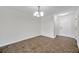 Dining room showcasing tile floors, overhead lighting, and a white front door at 11611 Mango Ridge Blvd, Seffner, FL 33584