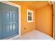 A covered doorway entrance featuring a light-blue painted door at 11611 Mango Ridge Blvd, Seffner, FL 33584