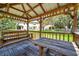 Gazebo interior with picnic table and swing at 11611 Mango Ridge Blvd, Seffner, FL 33584