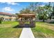 A charming gazebo in a well-maintained community lawn at 11611 Mango Ridge Blvd, Seffner, FL 33584