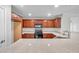 Updated kitchen featuring modern appliances, solid countertops, and ample cabinet space for storage at 11611 Mango Ridge Blvd, Seffner, FL 33584