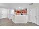Open kitchen design featuring a breakfast bar that connects to the Gathering and dining room space at 11611 Mango Ridge Blvd, Seffner, FL 33584