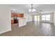 Spacious living room with breakfast bar next to the kitchen area with tile floors at 11611 Mango Ridge Blvd, Seffner, FL 33584