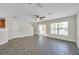 Spacious living room with ceiling fan and sliding glass doors to the patio at 11611 Mango Ridge Blvd, Seffner, FL 33584