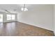 Bright living room featuring ceiling fan, neutral walls, and tile floors at 11611 Mango Ridge Blvd, Seffner, FL 33584