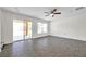 The living room features sliding glass doors to the patio and a ceiling fan at 11611 Mango Ridge Blvd, Seffner, FL 33584