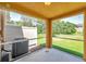 A screened lanai with an AC unit, providing a relaxing outdoor space overlooking the yard at 11611 Mango Ridge Blvd, Seffner, FL 33584
