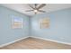 Bedroom featuring ceiling fan, flooring, and natural lighting at 12400 Park Blvd # 210, Seminole, FL 33772