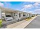 Charming single-story home with carport, brick facade, and manicured landscaping at 12400 Park Blvd # 210, Seminole, FL 33772