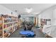 Well-equipped gym and library featuring bookshelves stocked with books and stationary bikes for exercise at 12400 Park Blvd # 210, Seminole, FL 33772