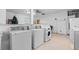 Clean community laundry room with multiple modern washing machines for convenience at 12400 Park Blvd # 210, Seminole, FL 33772