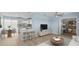 Open living area seamlessly connects to a modern kitchen with a breakfast bar and dining area at 12400 Park Blvd # 210, Seminole, FL 33772