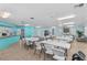 Bright community room with tables, chairs, and kitchenette, perfect for gatherings and activities at 12400 Park Blvd # 210, Seminole, FL 33772